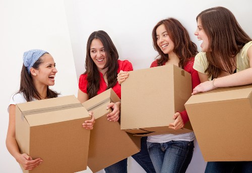 Removal crew loading household items for a move across London