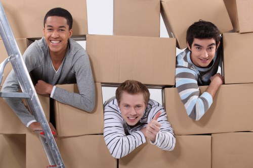 Workers organizing storage racks and checking inventory in a storage facility